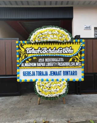 Papan Bunga Duka di Poigar